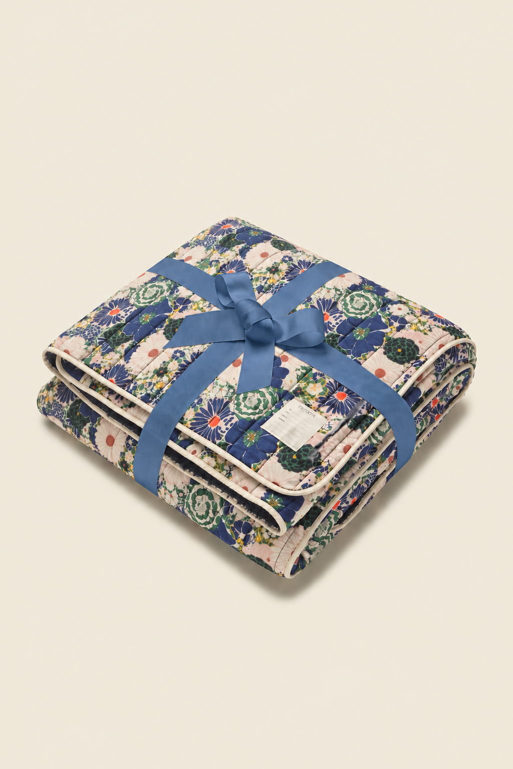 Trovata Medley printed throw blanket — gift-wrapped with a blue ribbon